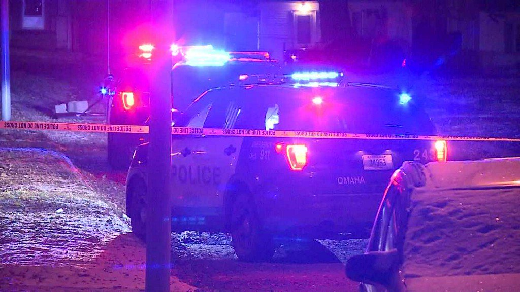 A woman suffered critical injuries when someone opened fire outside an Omaha home, police said.