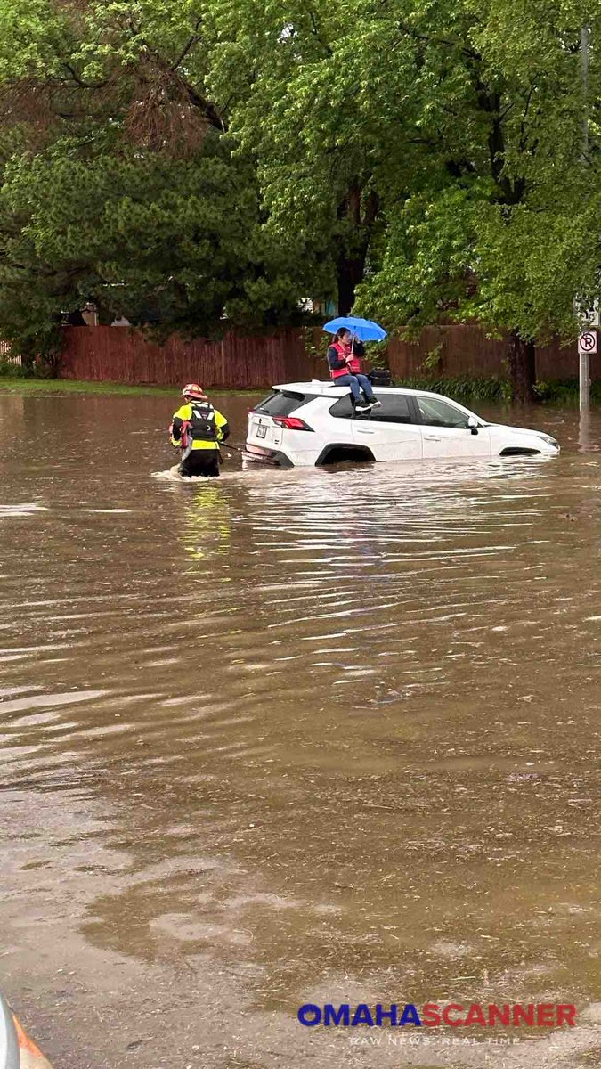 Omaha Fire Department rescuing stranded motorists near 96th and Q Street this morning due to the flood waters