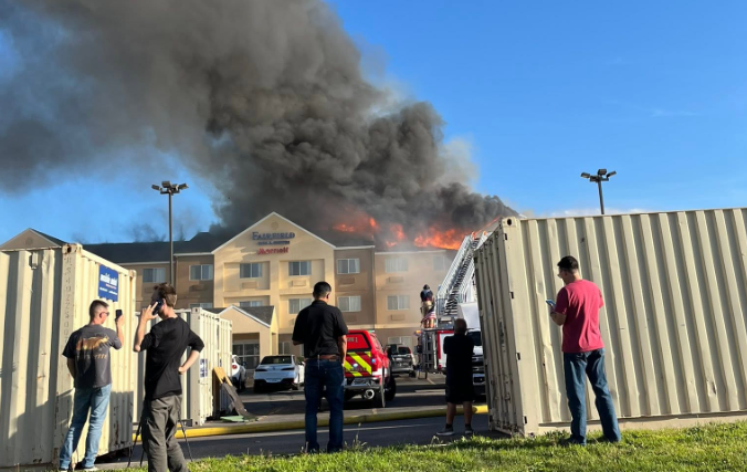 A Marriott hotel was declared a total loss after an improperly discarded cigarette ignited a fire. Fire officials say the flames caused the third and second floor of the Marriott to collapse into the first